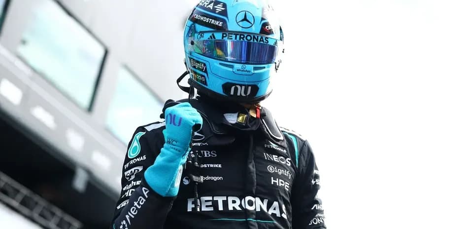 Formula 1 driver celebrating in racing suit