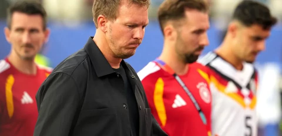 Trio of players walking off field after match