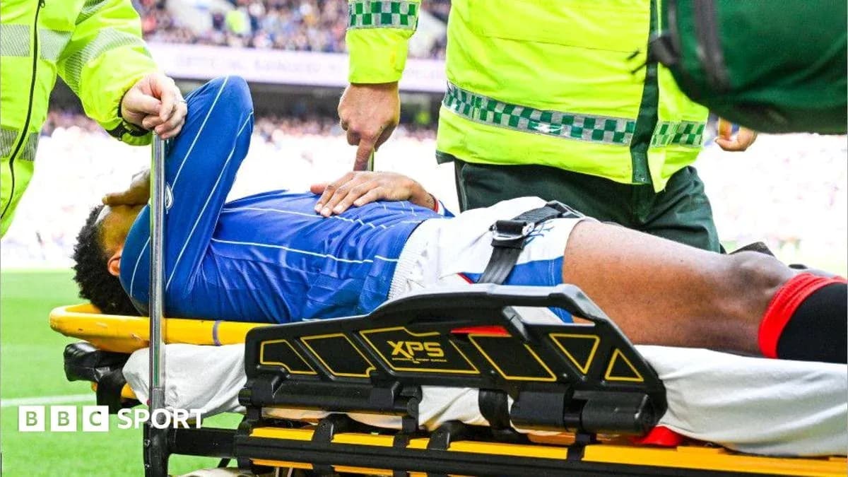 Player being carried on stretcher by medical staff
