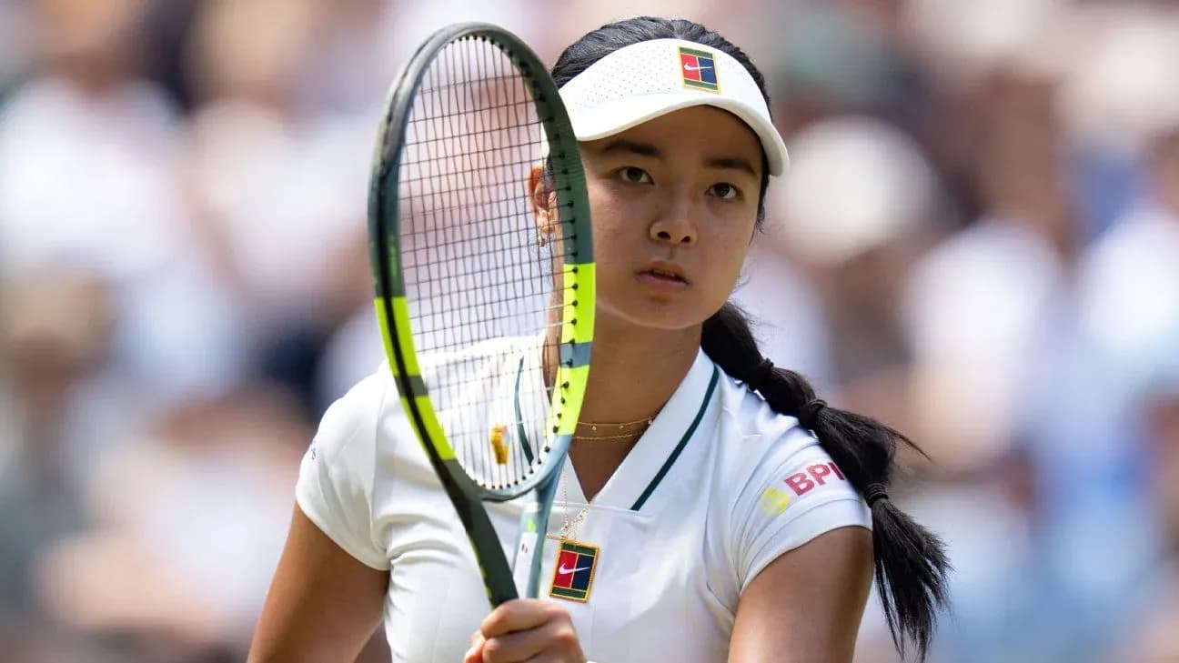 Tennis player preparing to serve on court