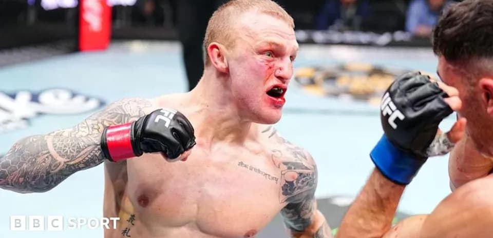 Fighter delivering a punch in UFC match