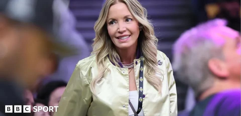 Woman in a golden jacket at basketball game