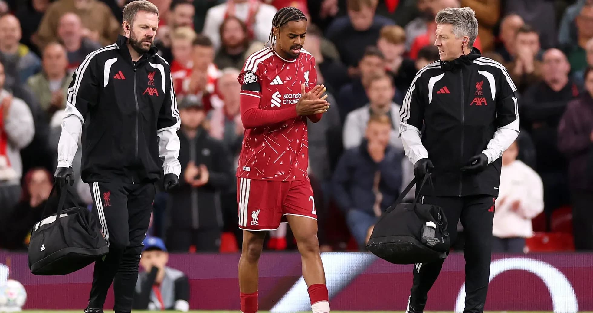 Liverpool player receiving medical attention off the field