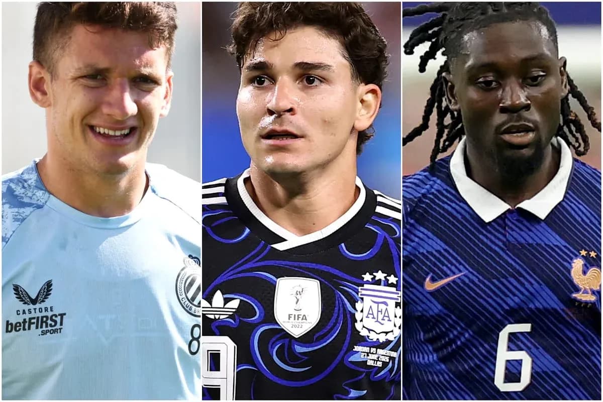 Three football players in team jerseys posing together