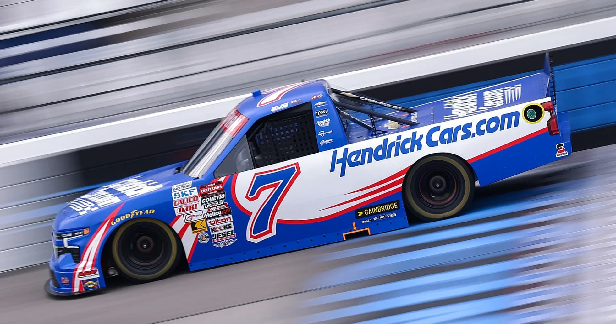NASCAR truck racing on the track at speed
