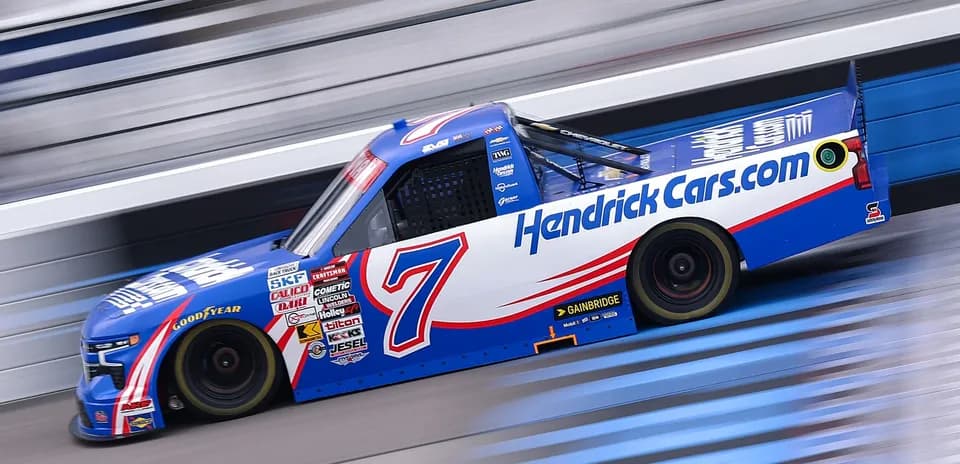NASCAR truck racing on the track at speed