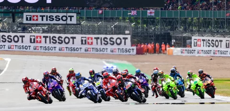 Motorsport race with multiple riders competing on track