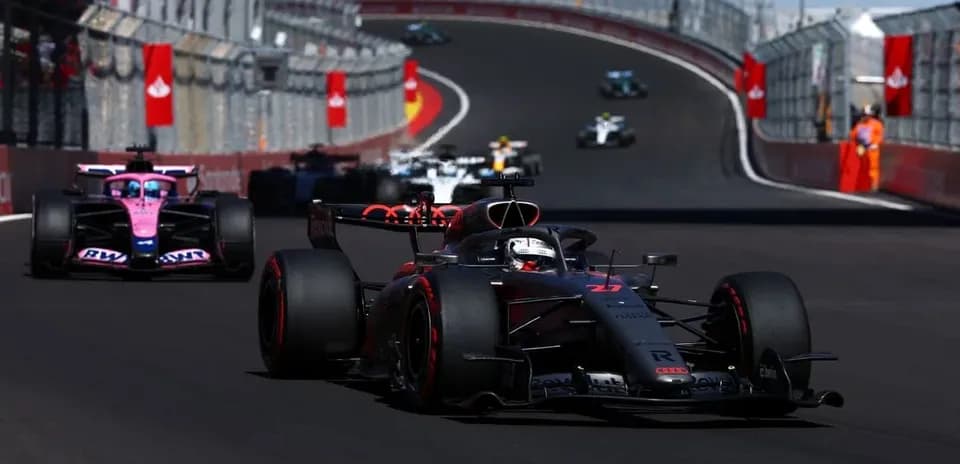 Formula 1 cars racing on circuit track