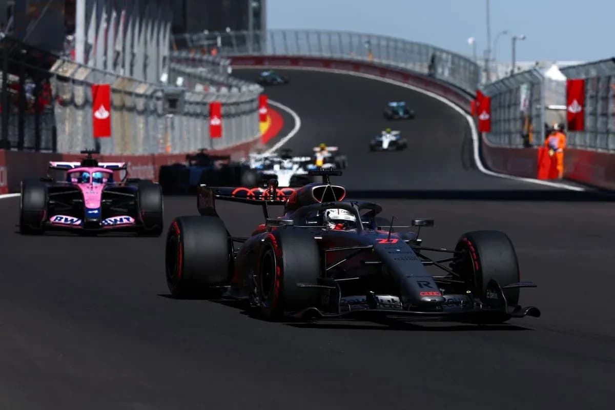 Formula 1 cars racing on circuit track