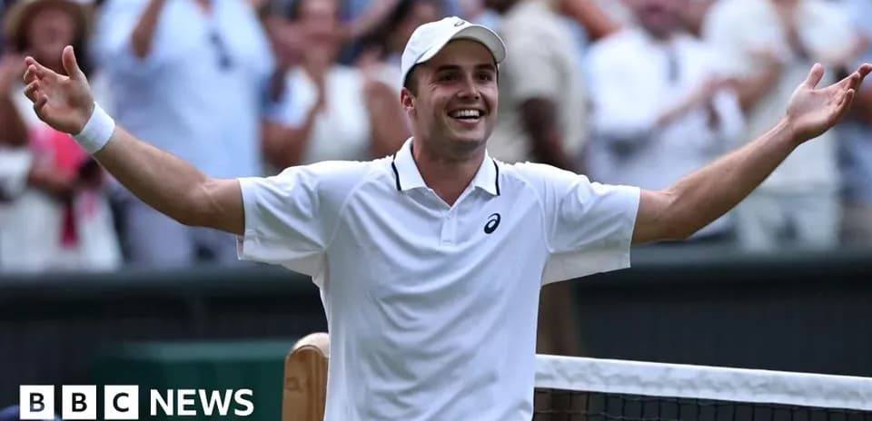 Tennis player celebrating victory at Wimbledon