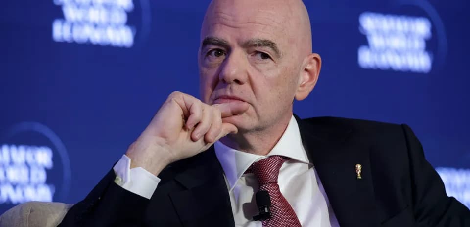 Man in suit speaking at conference