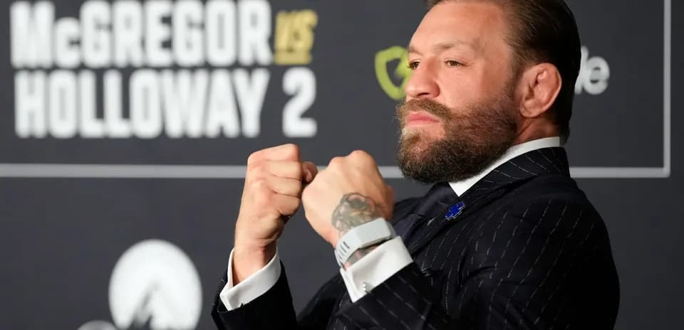 Conor McGregor posing at press conference for fight