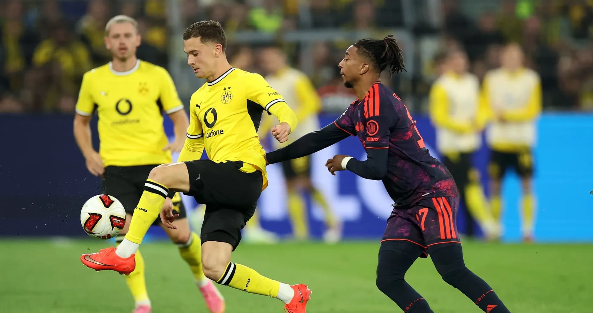 Borussia Dortmund player controlling the ball during match