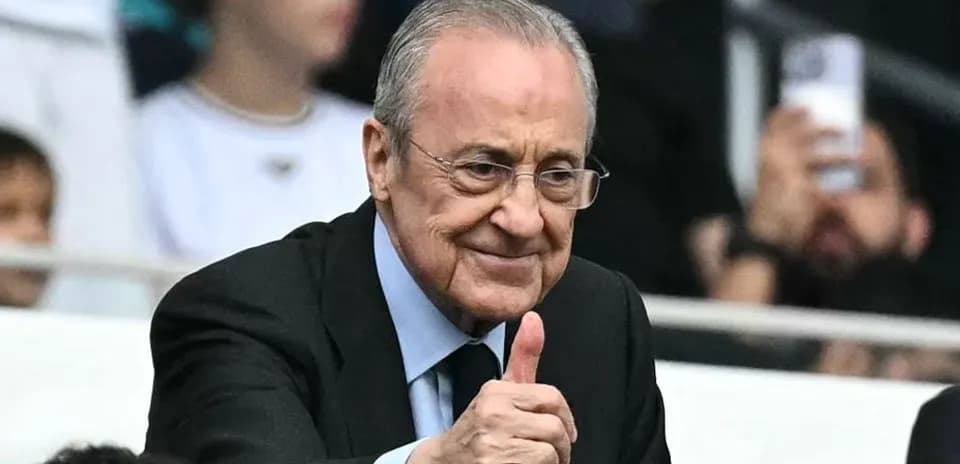 Man giving thumbs up in stadium stands