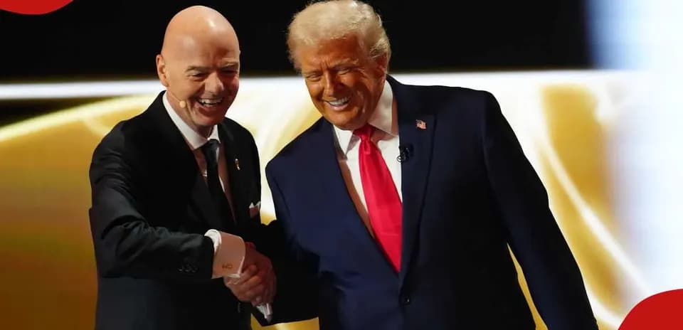 Two men shaking hands on stage during event