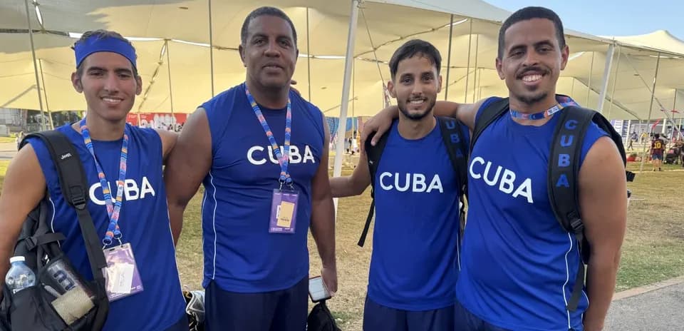 Cuban team members posing together in sportswear