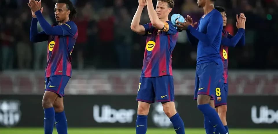 Barcelona players applauding fans after the match