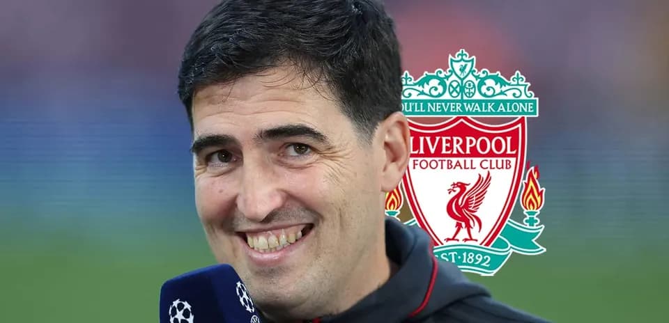 Reporter smiling with Liverpool logo in background