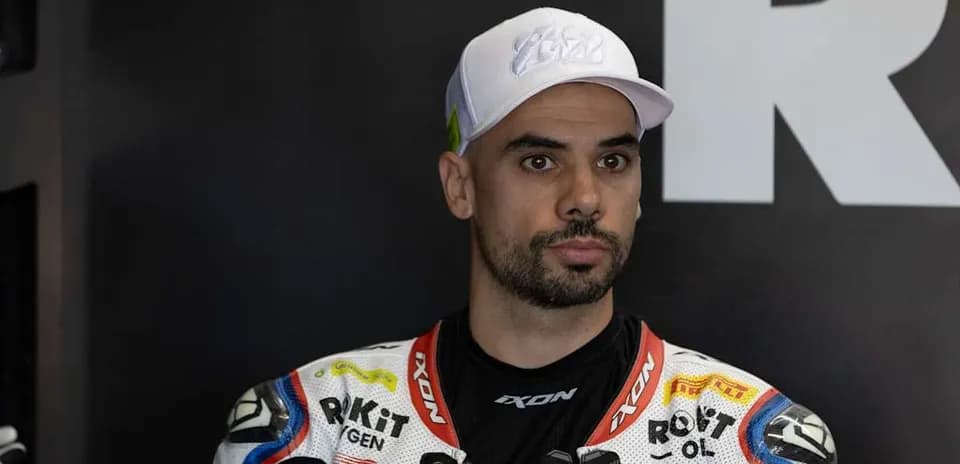 Motorsport athlete in racing suit and cap