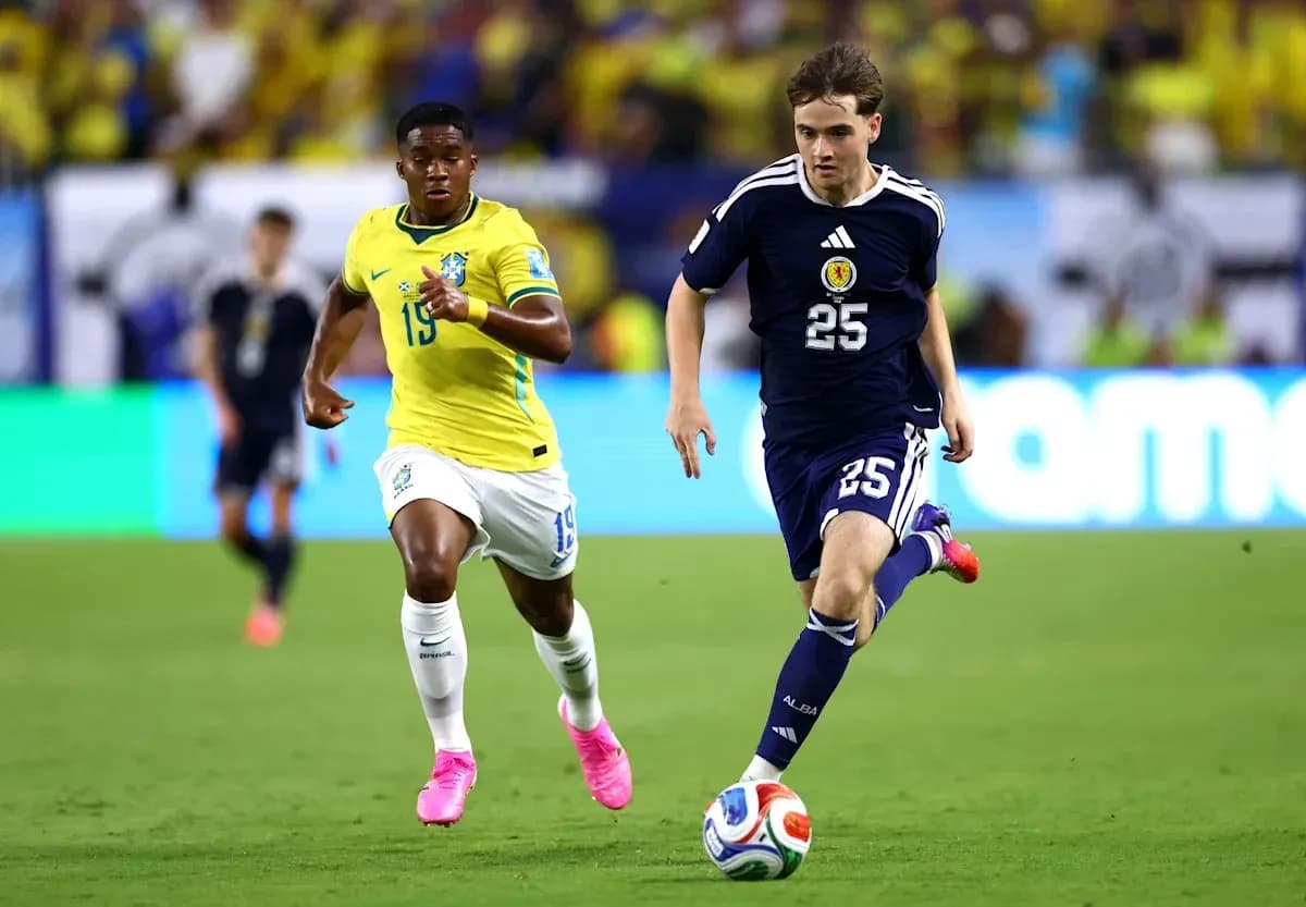 Brazil and Scotland players competing for the ball
