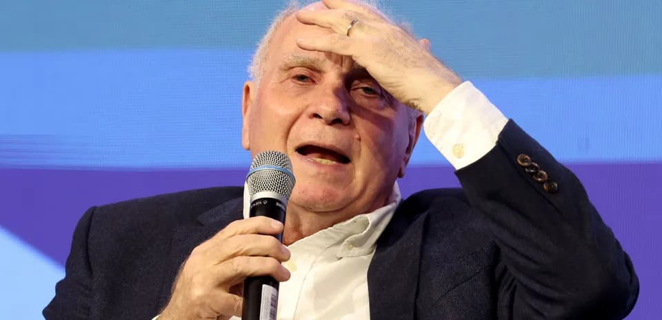 Speaker discussing at event with microphone in hand