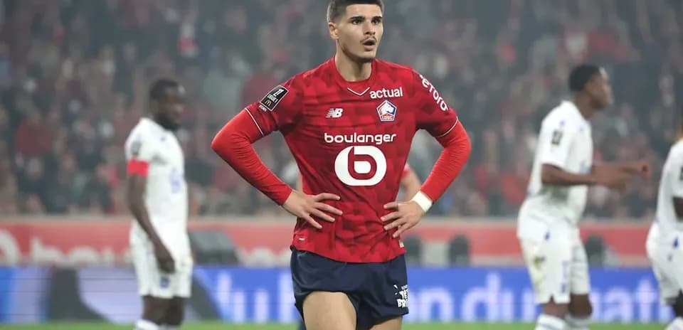 Lille player standing on field during match