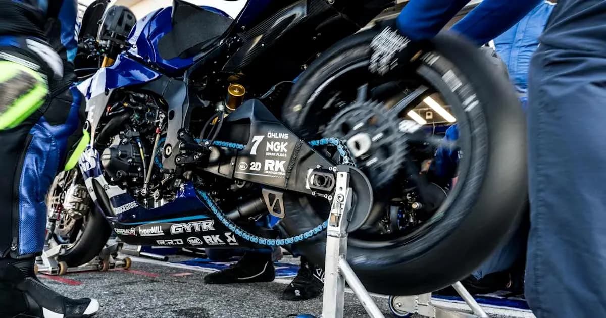 Motorcycle undergoing tire change in the pit