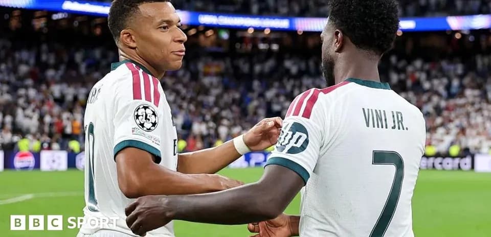 Mbappé and Vini Jr. celebrating on the pitch