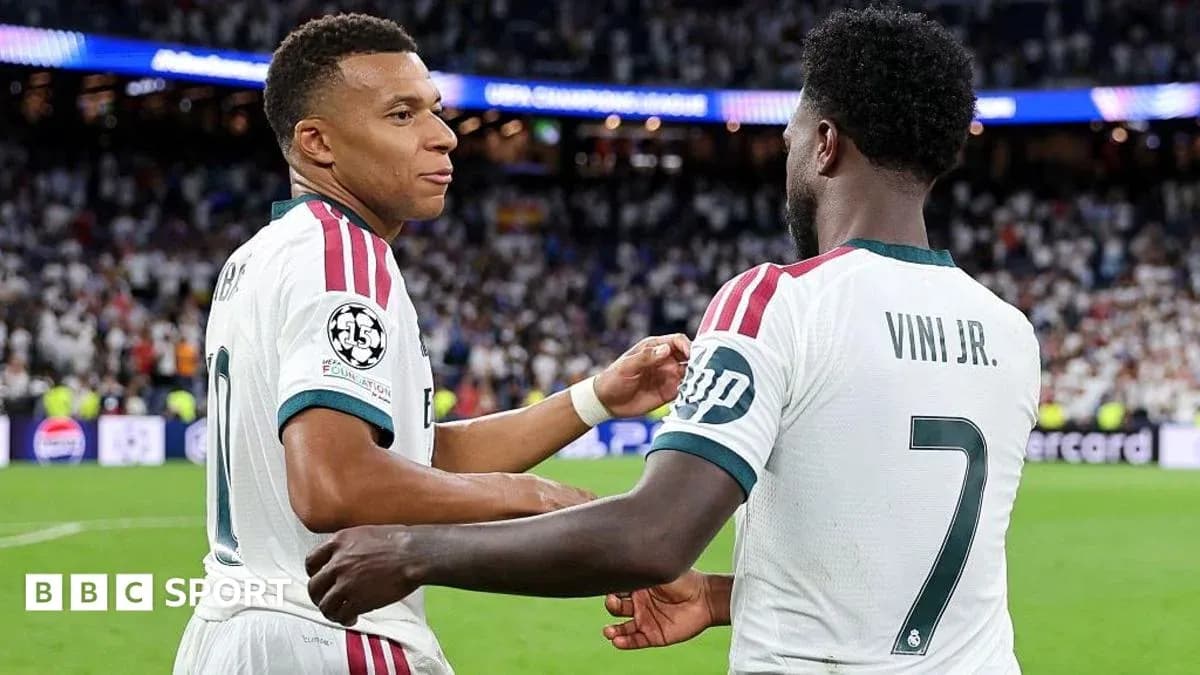 Mbappé and Vini Jr. celebrating on the pitch