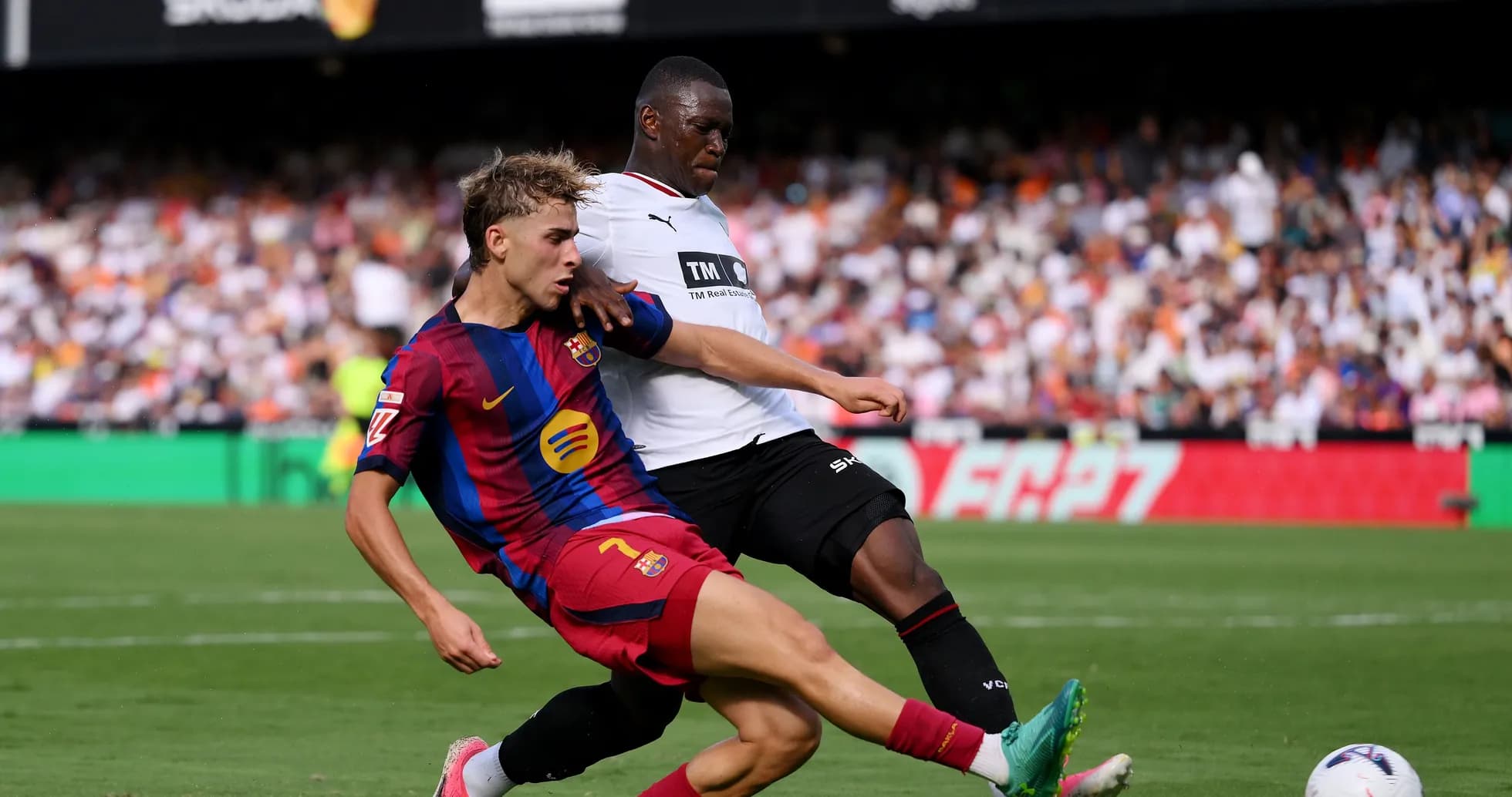 Barcelona player tackled by opponent during match
