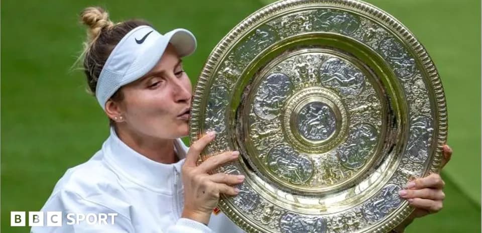 Tennis player kissing championship trophy on court