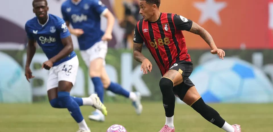 Bournemouth player dribbling past Everton defender