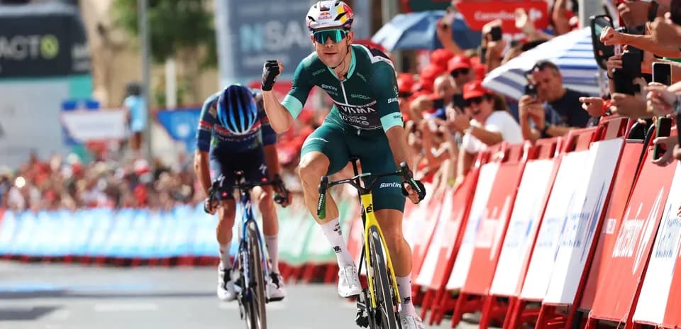 Cyclist celebrating victory at race finish line