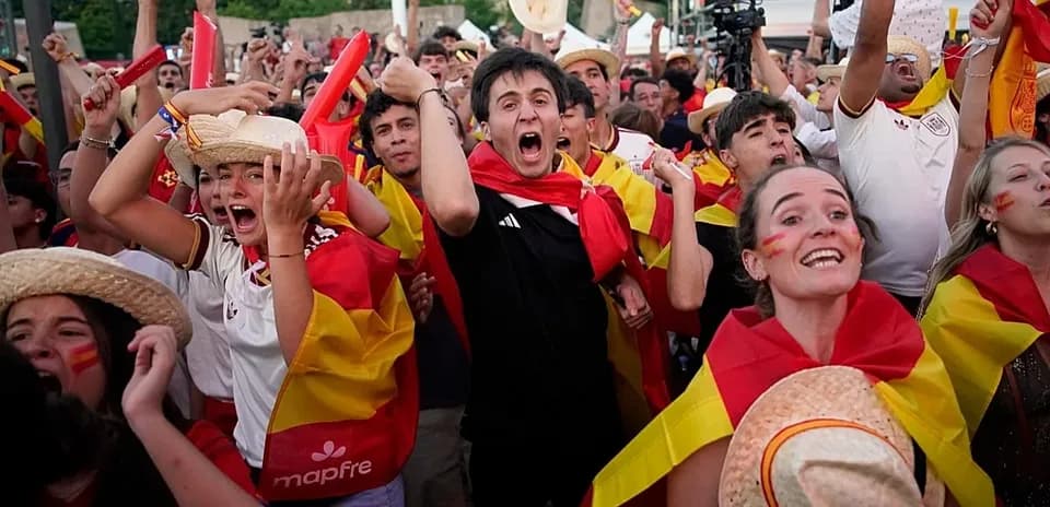 Fans celebrating with flags during a sports event