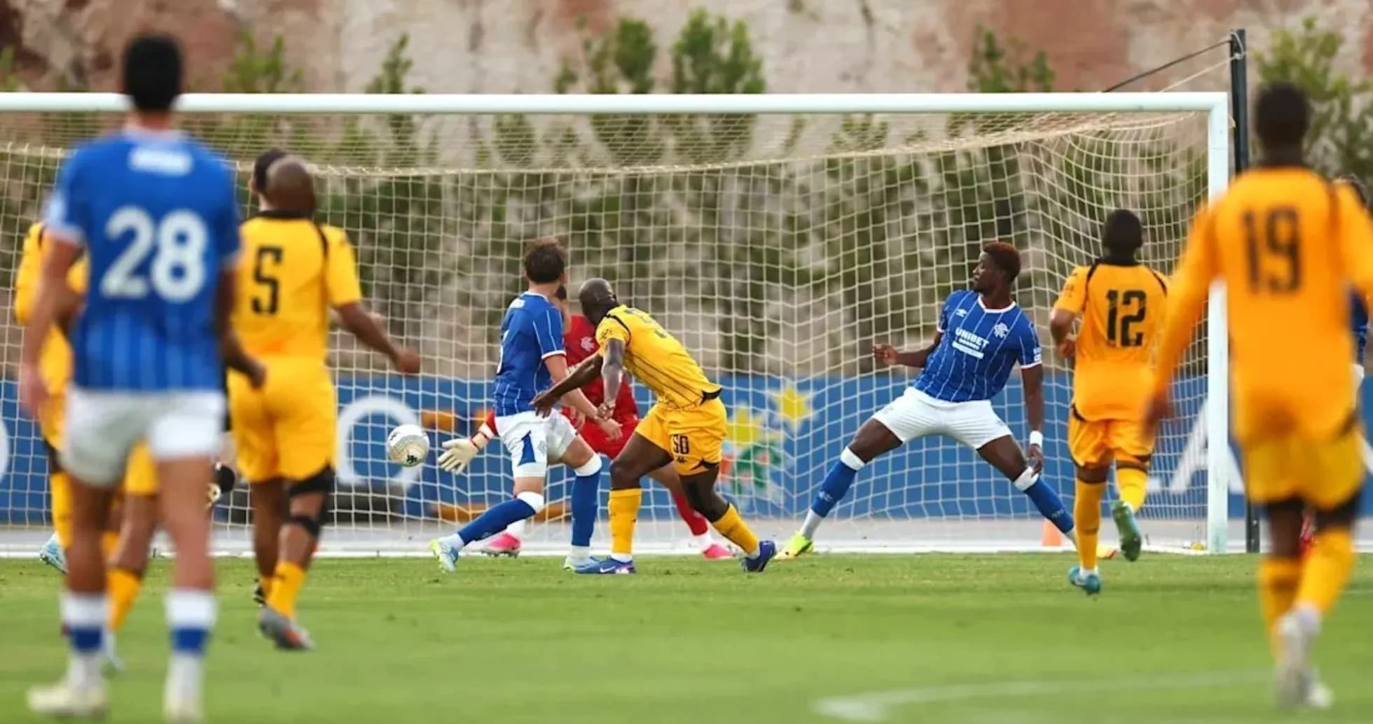 Football players during a match near the goal
