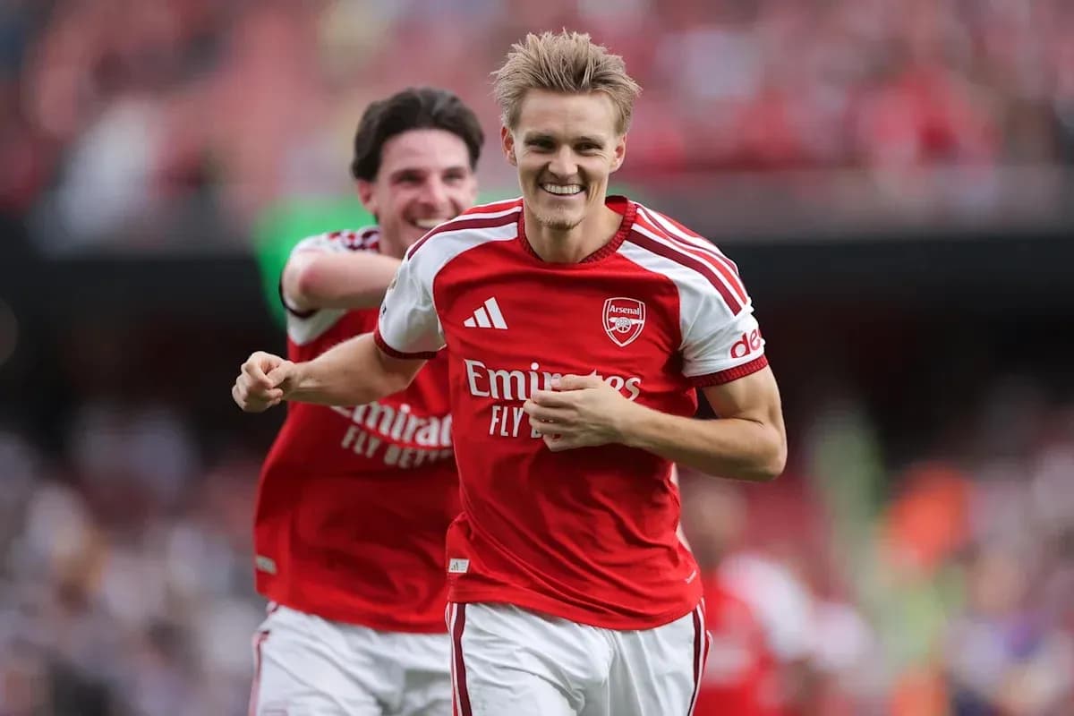Arsenal players celebrating a goal on the pitch
