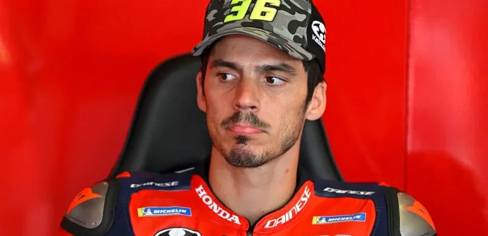 Motorsport athlete sitting in team garage before race