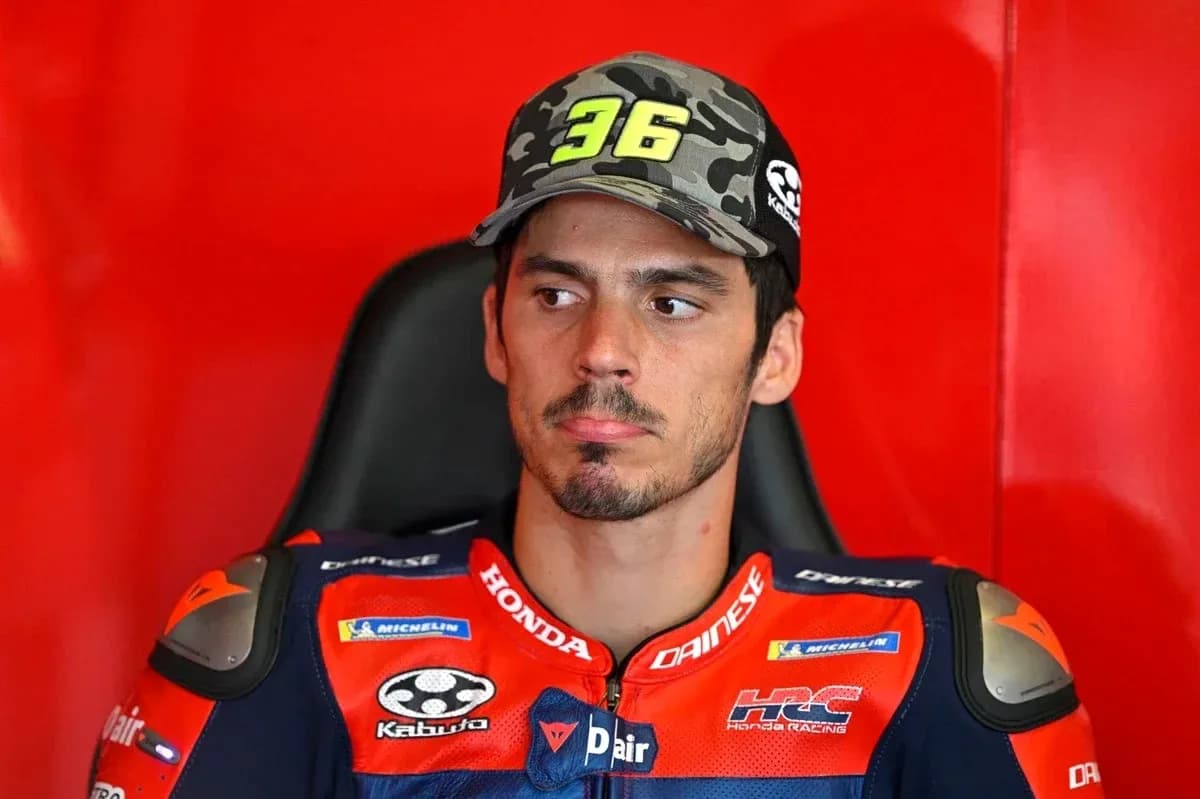 Motorsport athlete sitting in team garage before race