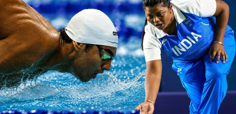 Svetlana swimming while coach gives instructions