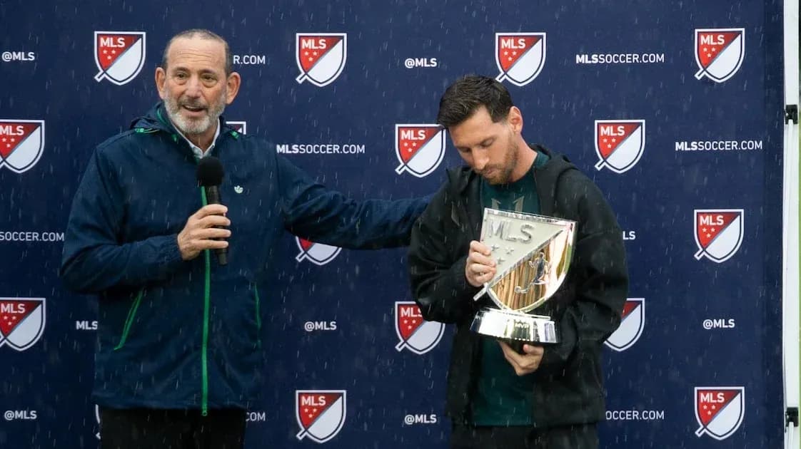 Lionel Messi receiving award during press conference