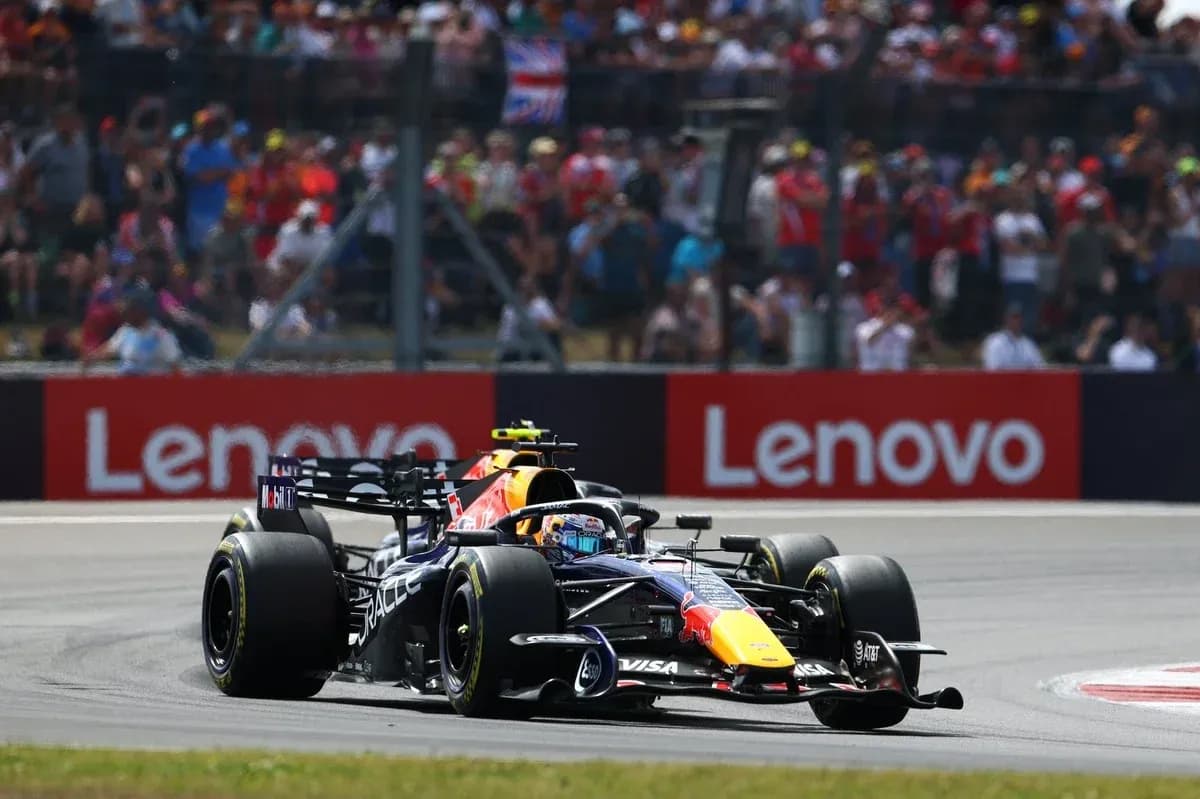 Formula 1 car racing on track with spectators