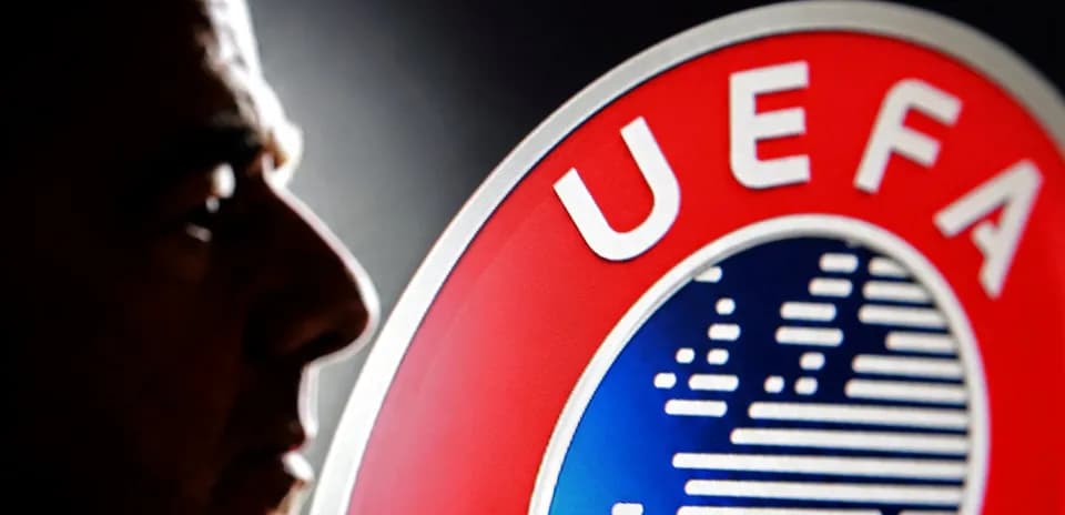 Shadows of a person next to UEFA logo