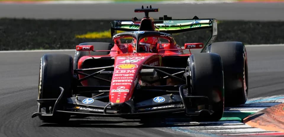 Ferrari F1 car racing on track during event