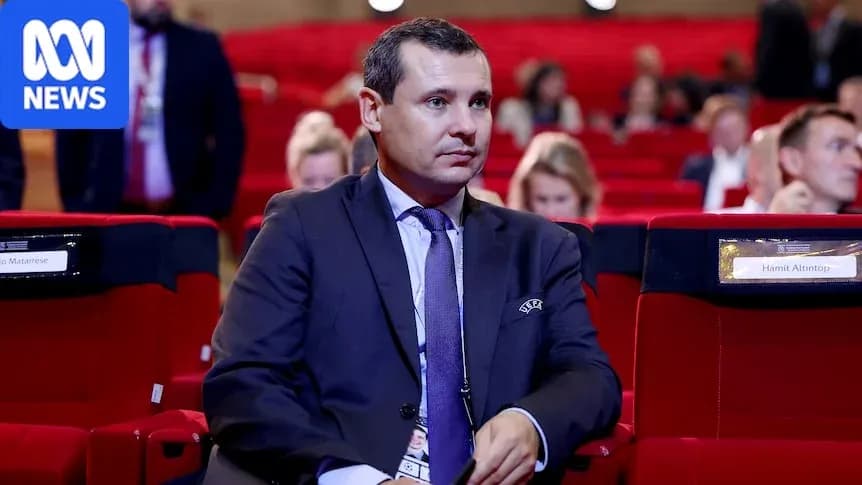 Man sitting in conference hall with empty seats