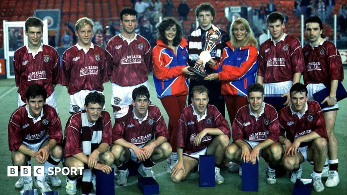 Football team posing with trophy and supporters