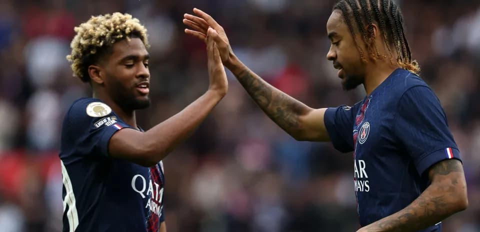 PSG players celebrating with a high-five