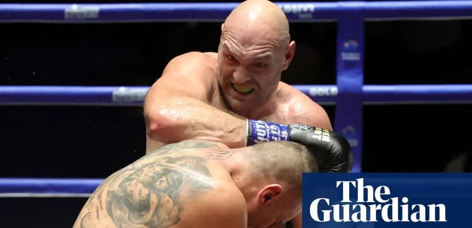 Boxer throwing a punch at opponent in ring