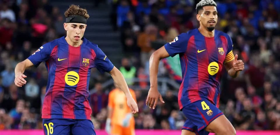 Barcelona players running on the pitch during match
