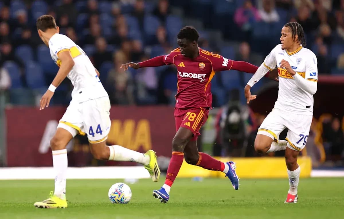 AS Roma player dribbling past two opponents