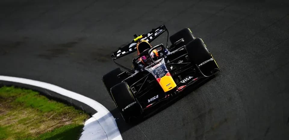 Formula 1 car navigating a racetrack corner